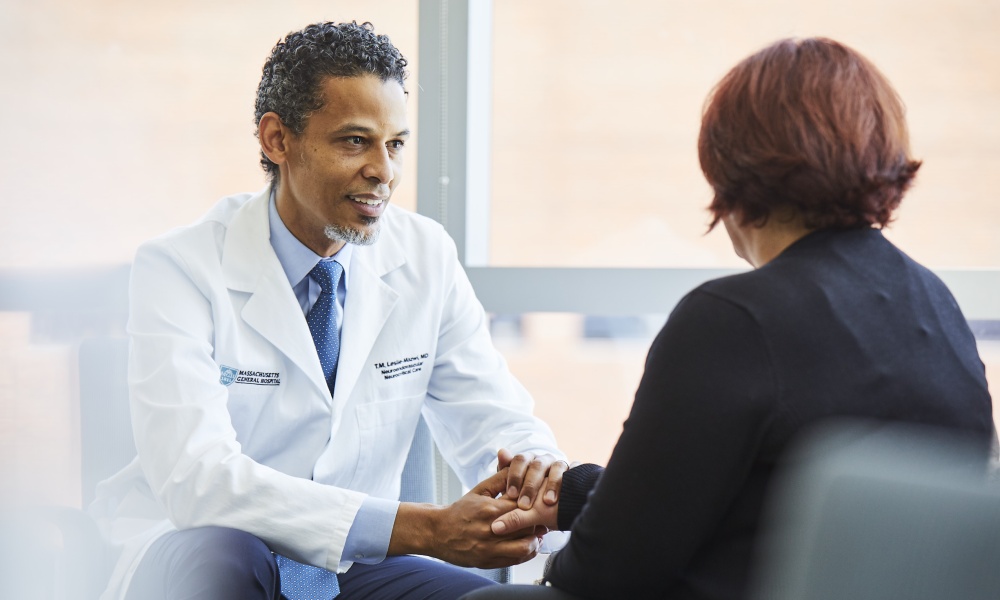 Consulting with a patient at a follow-up visit. Consulting with a patient at a follow-up visit.