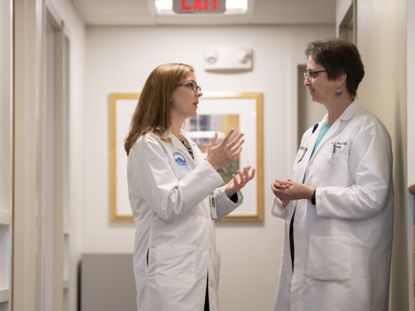 Doctors speaking in a hallway