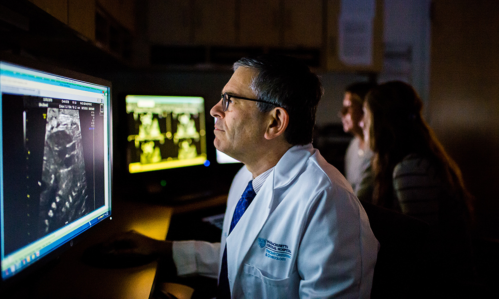 Dr. Jeffrey Ecker reads a patient's ultrasound. Dr. Jeffrey Ecker reads a patient's ultrasound.