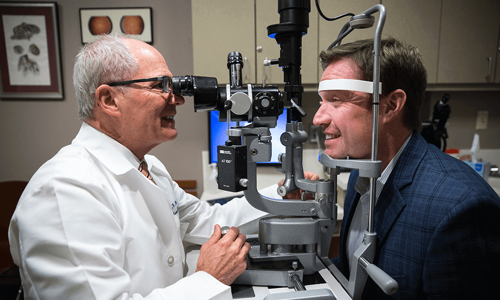 A doctor examines a patient's eyes A doctor examines a patient's eyes