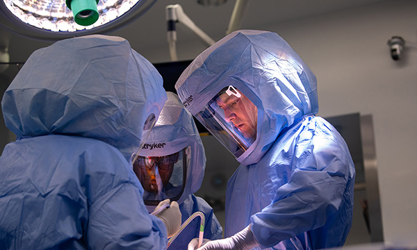 Dr. Christopher Melnic, Director of the Adult Reconstructive Surgery Fellowship Program, during surgery Dr. Christopher Melnic, Director of the Adult Reconstructive Surgery Fellowship Program, during surgery