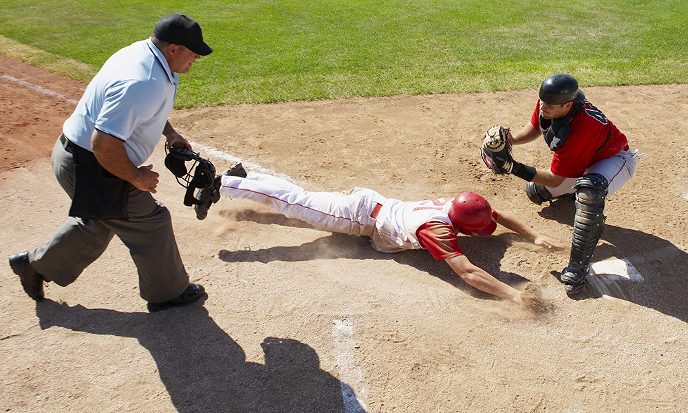 A baseball player sliding into home plate, Sports Medicine Center at Mass General, Boston A baseball player sliding into home plate, Sports Medicine Center at Mass General, Boston