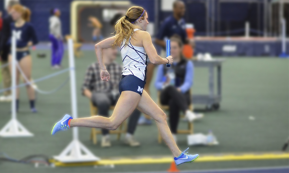Emily, a patient of the Women's Sports Medicine Program clinic, running during a track meet Emily, a patient of the Women's Sports Medicine Program clinic, running during a track meet