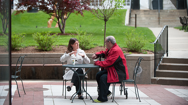 A Mass General Patient Advocate having a discussion with a patient.  A Mass General Patient Advocate having a discussion with a patient.