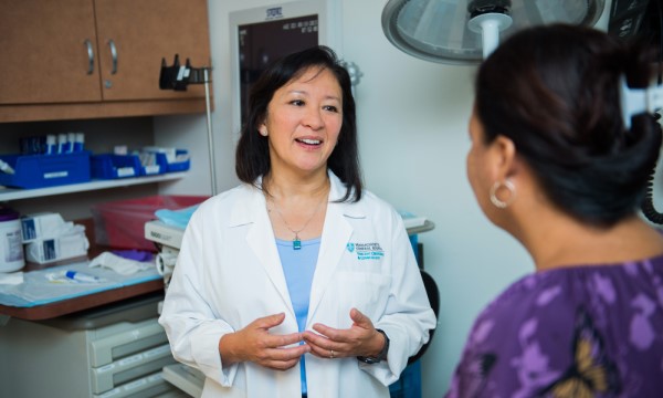 Dr. Wakamatsu talks with a patient.