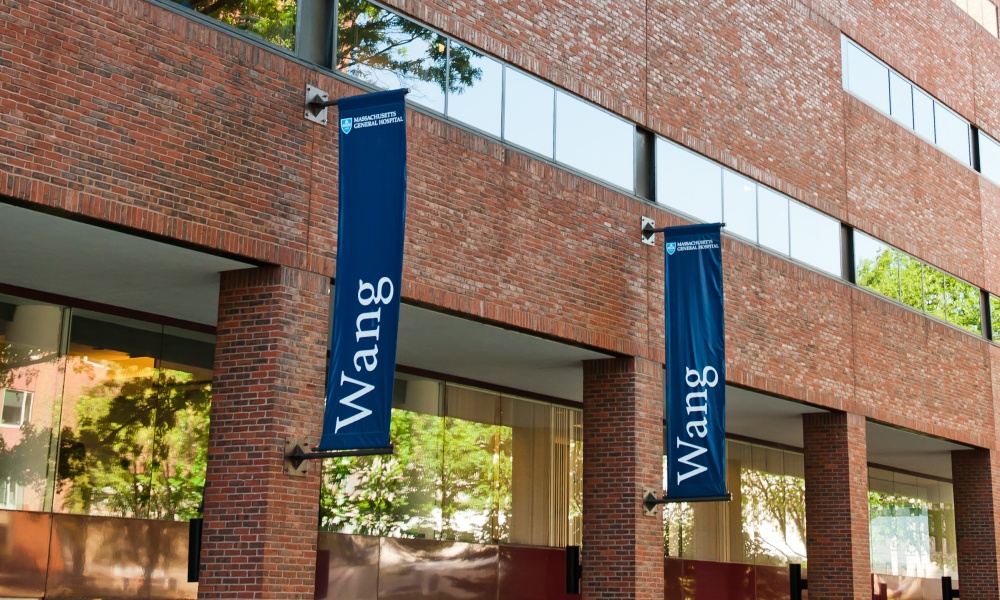 The brick front of the Wang Building, on Mass General's Boston campus, on a sunny day The brick front of the Wang Building, on Mass General's Boston campus, on a sunny day