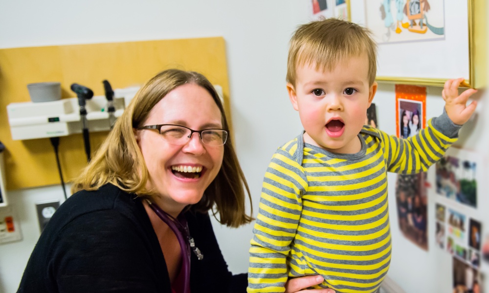 Doctor & baby share a laugh