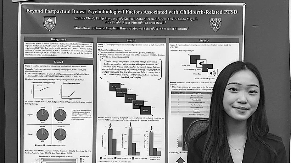 Researcher in front of a research poster Researcher in front of a research poster