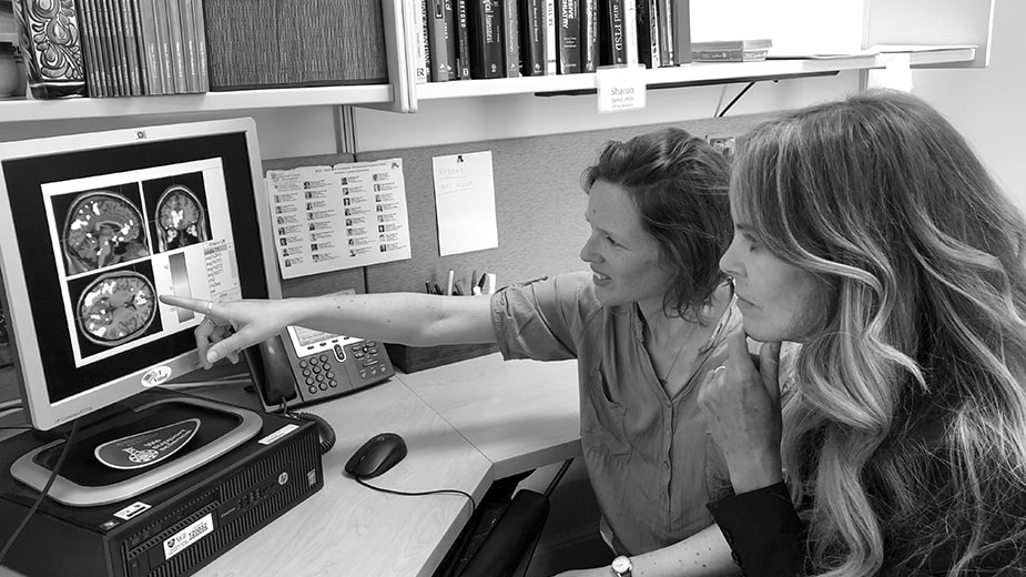 Dekel and colleague looking at image on a computer Dekel and colleague looking at image on a computer