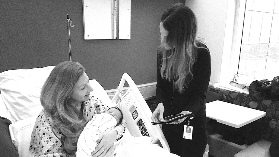 Dr. Dekel with a patient and baby Dr. Dekel with a patient and baby