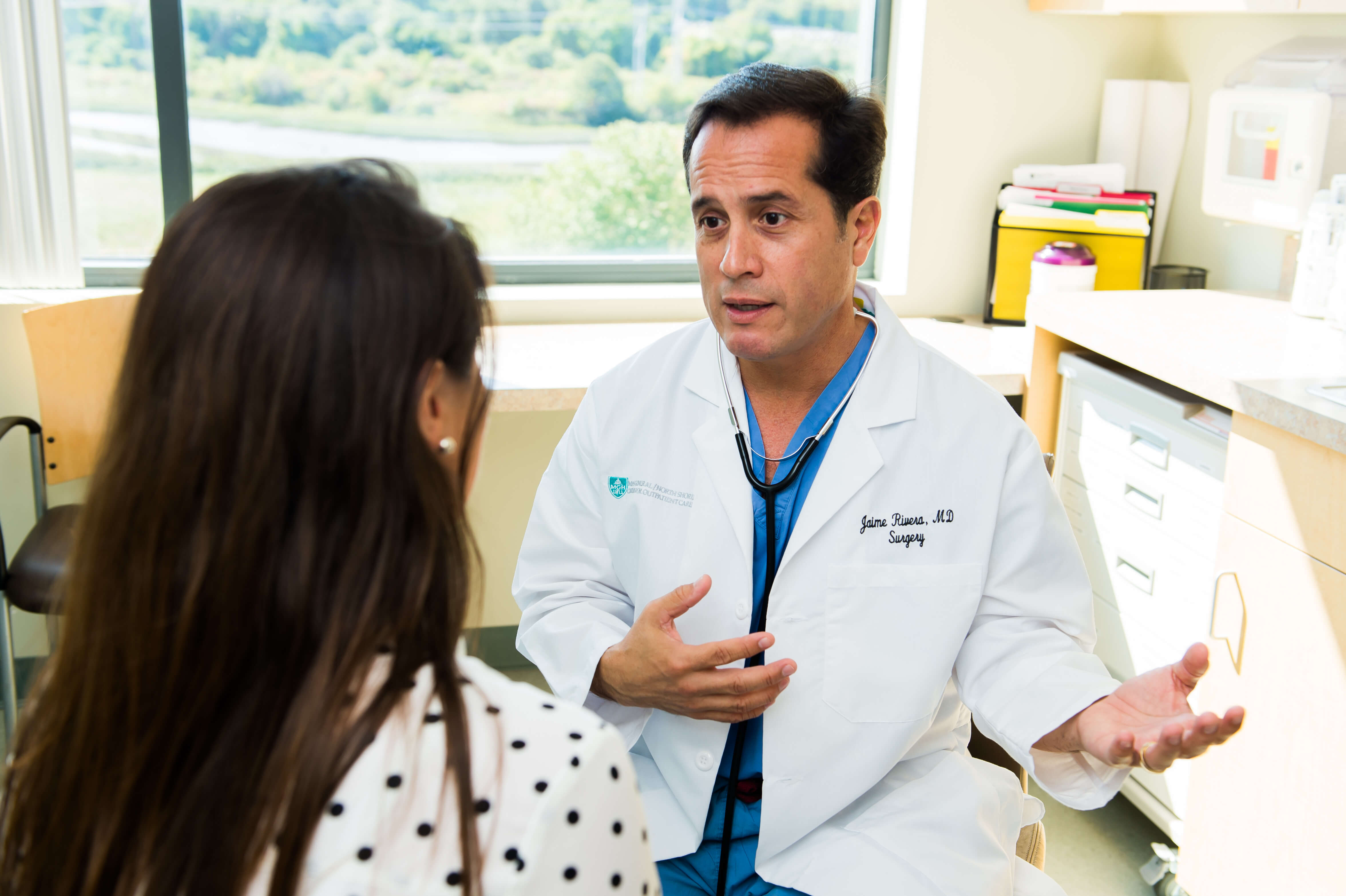 Jaime Rivera, MD, is speaking with a patient Jaime Rivera, MD, is speaking with a patient