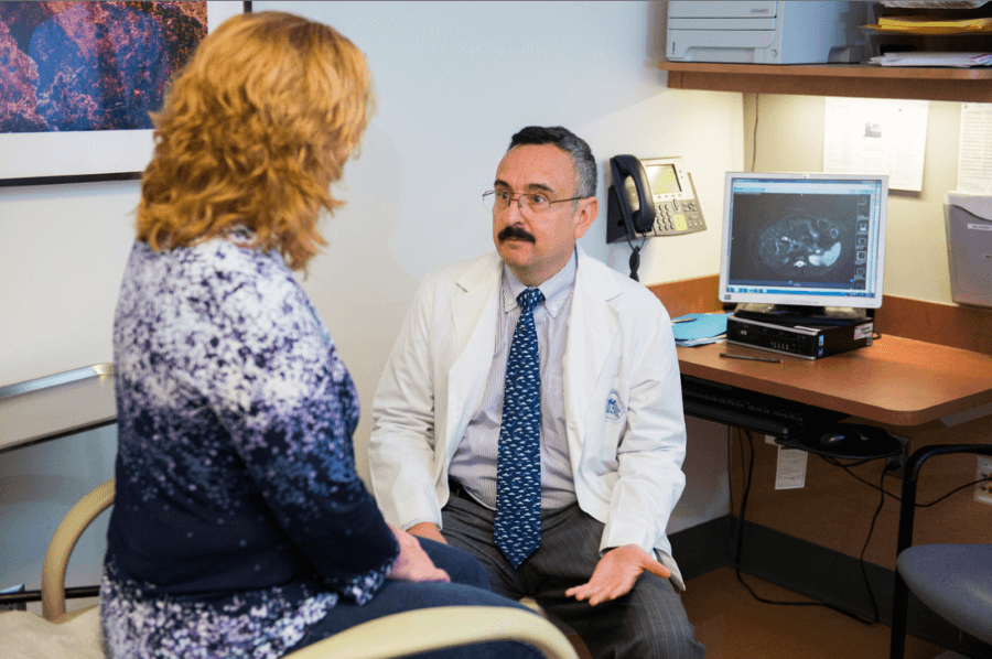 Dr. Fernandez-del Castillo with a patient.