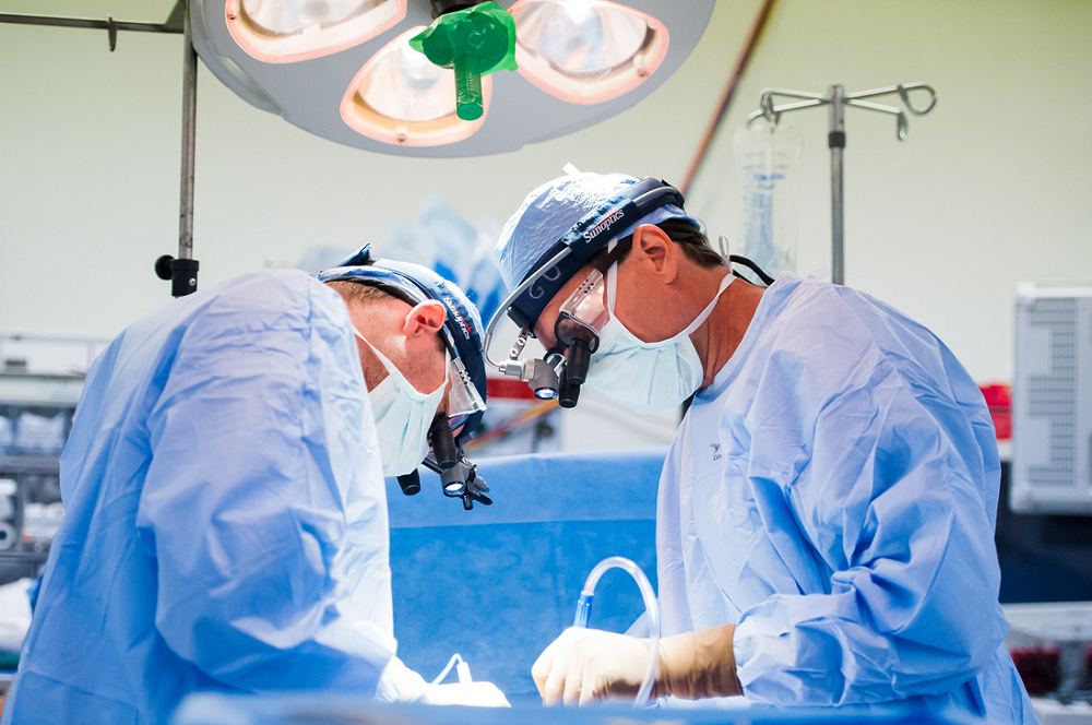 Dean Donahue, MD (right), and Eric Feins, MD (left), perform a complex surgery for a patient with thoracic outlet syndrome. Dean Donahue, MD (right), and Eric Feins, MD (left), perform a complex surgery for a patient with thoracic outlet syndrome.