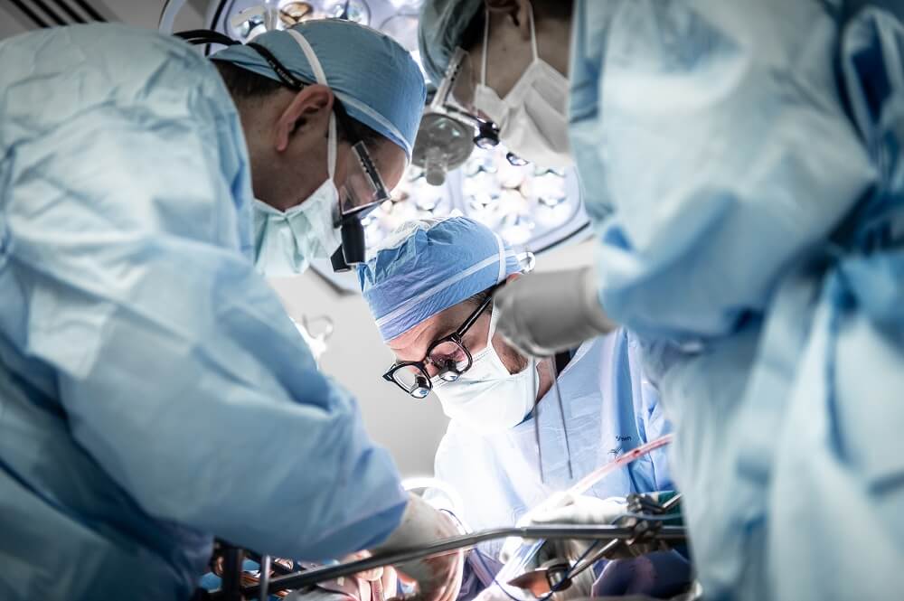 Three doctors in the operating room Three doctors in the operating room