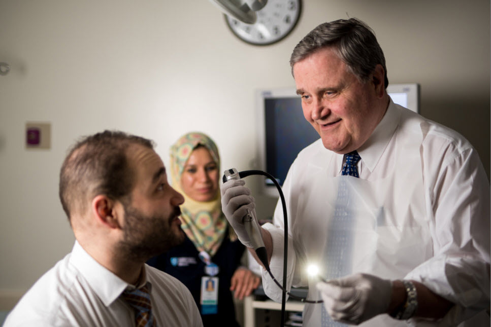 Dr. Blute, Chief of the Urology Department, explains a procedure to a patient. Dr. Blute, Chief of the Urology Department, explains a procedure to a patient.